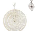 the earrings are white and have a spiral design on them