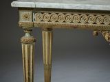 an image of a marble topped table with ornate carvings on the top