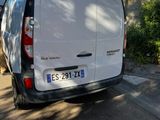 a white van that is parked on the side of the road