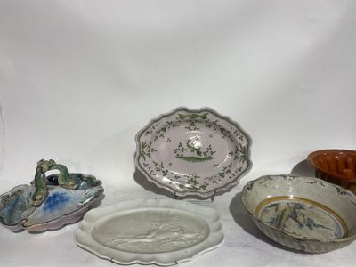 many different types of plates and bowls on the table
