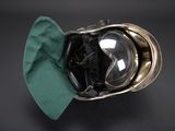 a helmet with goggles and a green cloth