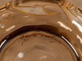 a close up of a glass vase with writing on it