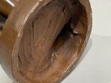 a pipe that has chocolate in it on a table