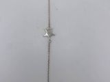 a silver necklace with a star charm on it