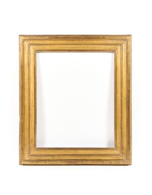 a gold frame on a white wall with a white background