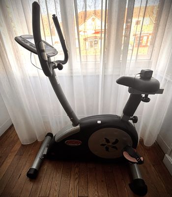 a stationary exercise bike in the corner of a room