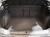 a trunk of a car that is empty with the door open
