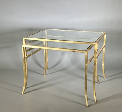 an image of a glass and brass coffee table on a grey background