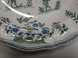 a plate with a picture of a man and a woman on it