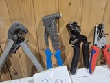 many different types of pliers on a table
