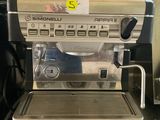 a coffee machine sitting on a counter in a kitchen