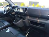 the interior of a car with a steering control and dashboard controls