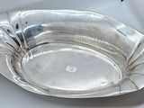 a silver plate that is sitting on a table