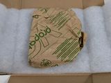 a cardboard box with a piece of paper in it