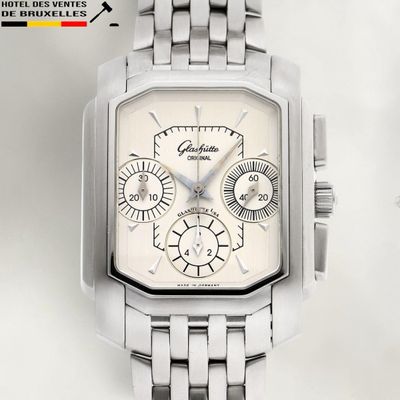 a silver watch with a white face on a white background