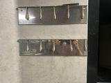 a person taking a picture in a mirror of a refrigerator