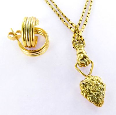 gold plated necklace with a lion head pendant and a chain
