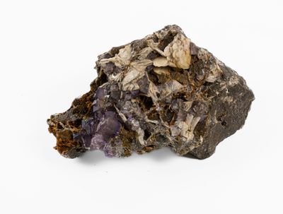 an image of a piece of rock with a purple substance