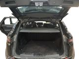 the back of a car with its trunk open and the back door open