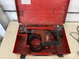 a red tool box with a drill in it