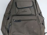 a backpack that is sitting on a white table