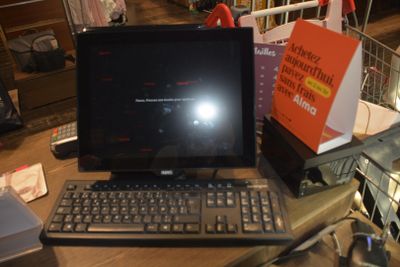 a laptop computer sitting on top of a wooden desk