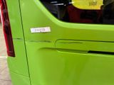 a green van with a sticker on the side of it