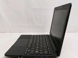 a black laptop with a blue keyboard on a white surface