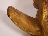 a close up of a statue of a banana on a white surface