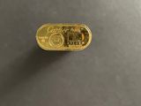 a close up of a gold bar sitting on top of a table