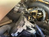 a close up of a dirty engine in a car