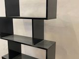 an image of a black and white bookshelf in a room