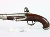 an old gun that is on display on a clear stand