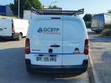 a white van that is parked on the side of the road