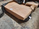 a box that is sitting on the ground next to a black bag
