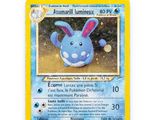 a close up of a pokemon card on a white surface