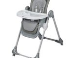 a baby high chair that has a tray in it
