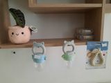 a shelf that has a bunch of baby items on it