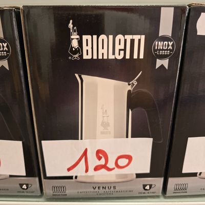 three boxes of wii controllers are on a shelf in a store