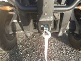 a close up picture of a vehicle with a tow cord attached to it