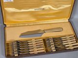 a case with a set of knives and a knife sharper
