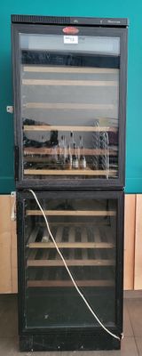 a wine cooler that has a bunch of bottles inside of it