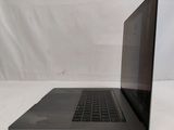 a laptop that is sitting on a white surface
