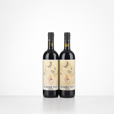 a couple of bottles of wine sitting on top of a table