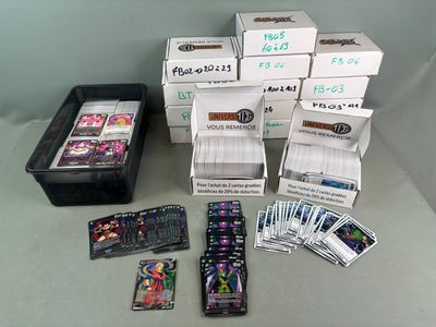 a lot of cards and remote controls on the table