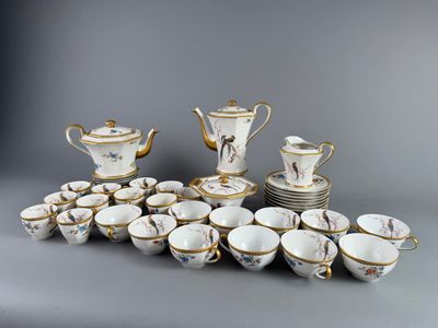 a group of porcelain cups and saucers on a table