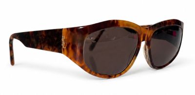 brown tortoise sunglasses on a white background on a white surface