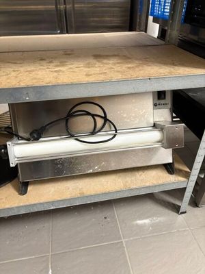 an image of a kitchen with a table and a stove
