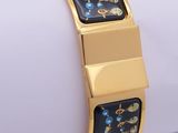 gold plated bracelet with black and blue enamel and gold plated clasp