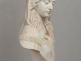 marble bust of a woman with a veil on her head